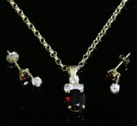 Lot 280 - A garnet and diamond pendant and matched earring suite