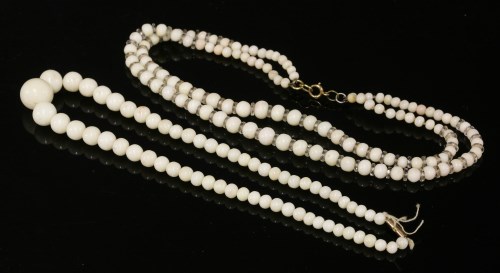 Lot 97 - A single row graduated white coral bead necklace