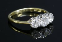 Lot 165 - An 18ct gold three stone diamond ring