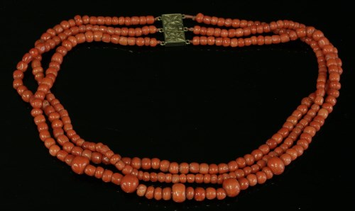 Lot 100 - A three-row graduated coral bead necklace