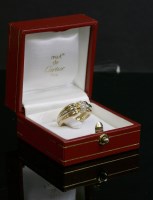 Lot 295 - A Cartier three-colour gold diamond set ring