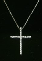 Lot 329 - A white gold diamond set cross and chain
