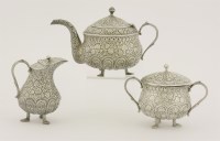 Lot 397 - An Indian white metal tea set