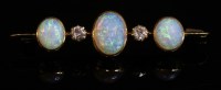 Lot 72 - An Edwardian five stone opal and diamond bar brooch