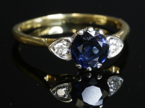 Lot 298 - An 18ct gold sapphire and diamond three stone ring