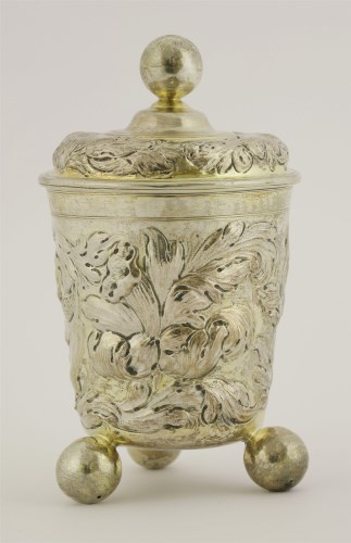 Lot 394 - A probably German parcel-gilt silver covered beaker