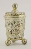 Lot 394 - A probably German parcel-gilt silver covered beaker