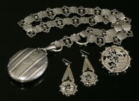 Lot 77 - A Victorian sterling silver Aesthetic Movement oval hinged locket