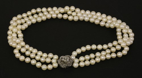Lot 184 - A three row uniform cultured pearl necklace