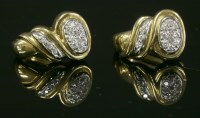 Lot 297 - A pair of two-colour 18ct gold diamond set hinged cuff earrings