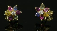 Lot 270 - A pair of gold and sapphire cluster earrings