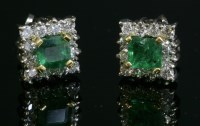 Lot 317 - A pair of yellow and white gold emerald and diamond square cluster earrings
