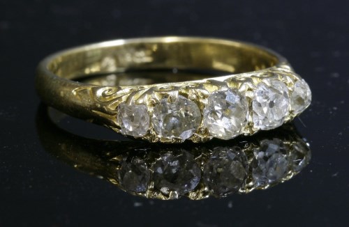 Lot 65 - A late Victorian five stone diamond carved head ring