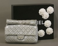 Lot 1061 - A Chanel iridescent silver quilted reissue roll clutch bag