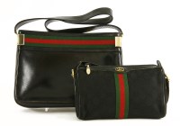 Lot 1004 - A Gucci vintage black leather handbag
with techno canvas banding and gold-tone hardware