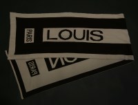 Lot 1446 - A Louis Vuitton dark brown and cream wool and cashmere scarf
monogrammed with maker's signature
