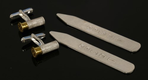 Lot 1581 - A pair of sterling silver shot gun cartridge swivel cufflinks by Holland and Holland