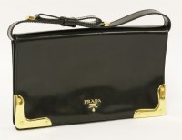 Lot 1013 - A Prada black patent leather clutch handbag