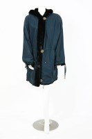 Lot 1304 - A designer green silk parka coat