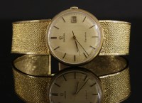 Lot 364 - A gentlemen's 9ct gold Omega Genève mechanical bracelet watch