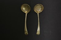 Lot 507 - A pair of George III silver gilt sifting spoons