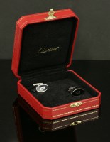 Lot 303 - A pair of sterling silver Cartier oval cufflinks