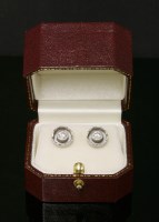 Lot 314 - A pair of platinum single stone diamond earrings