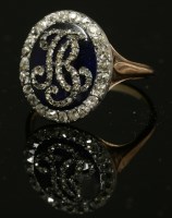 Lot 10 - A Georgian enamel and diamond set oval monogram ring