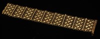 Lot 250 - A Continental lattice-effect plaque link bracelet