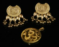 Lot 257 - A pair of Indian high carat gold drop earrings