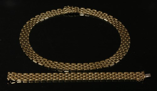 Lot 271 - A 9ct gold three-row panther necklace and bracelet suite