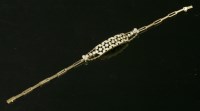 Lot 76 - A diamond set gold bracelet