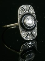 Lot 163 - An Art Deco diamond and onyx plaque ring