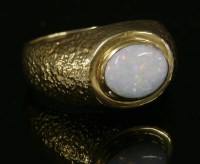 Lot 240 - A Continental gentlemen's single stone opal ring