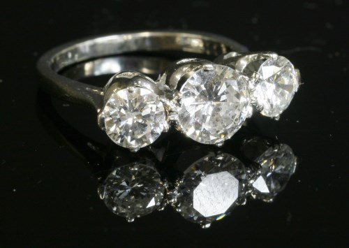 Lot 321 - A white gold three stone diamond ring