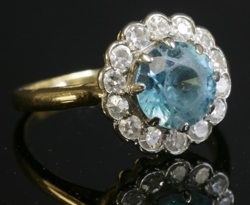 Lot 186 - A blue zircon and diamond circular cluster ring