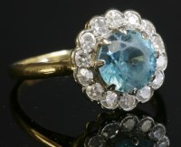Lot 186 - A blue zircon and diamond circular cluster ring