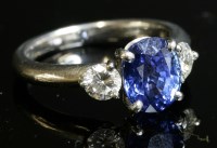 Lot 346 - A platinum three stone sapphire and diamond ring