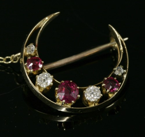 Lot 61 - A late Victorian seven stone ruby and diamond closed crescent brooch