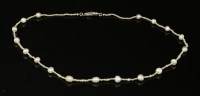 Lot 145 - A single row uniform seed pearl necklace