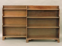 Lot 421 - A pair of mahogany 'waterfall' open bookshelves