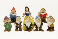 Lot 258 - A collection of Disney Japan porcelain figures of Snow White and the Seven Dwarfs