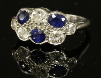 Lot 7 - A sapphire and diamond two-row cluster ring