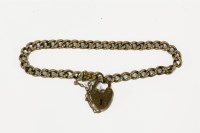 Lot 21 - A gold curb link bracelet