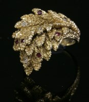 Lot 67A - A 9ct gold ruby and diamond leaf spray ring
