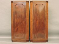 Lot 498 - A pair of mahogany corner cupboards