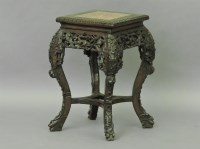 Lot 532 - A Chinese carved hardwood vase stand