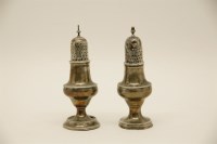 Lot 137 - A near pair of silver casters