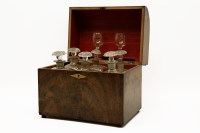Lot 426 - An early 19th century walnut cased decanter set