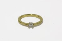 Lot 15 - An 18ct gold single stone emerald cut diamond ring